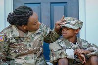 Staff Sgt. Courtney Smith plays with her son Ayden Clax, on Fort Bragg